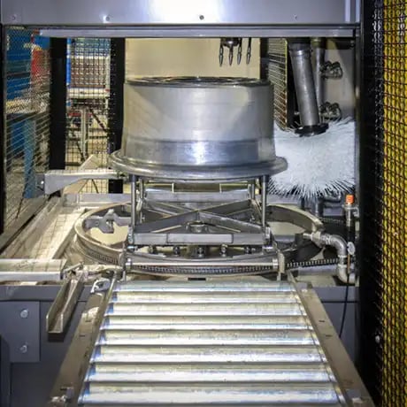 Aircraft wheel washer cleans wheel bearings wheels and brakes in the same washer