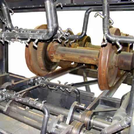 The PROCECO wheel set washer removes grease and road dirt from locomotive or car wheel sets