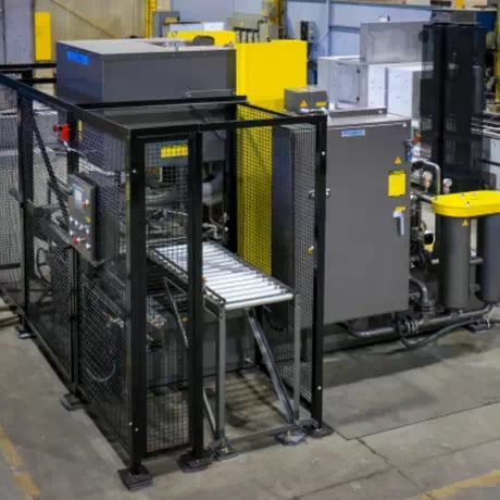 Aircraft wheel cleaning systems uses hot aqueous cleaning solution on wheel surface to remove rubber bead, grease and carbon.