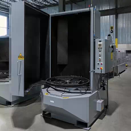 TYPHOON®-PCE ergonomic turntable parts washer in a workshop, showcasing its compact and efficient design for precision cleaning.