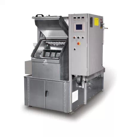 The spray-immersion cabinet washer cleans automotive transmission components like gears, clutches, and casings, ensuring deep cleaning and reliability.