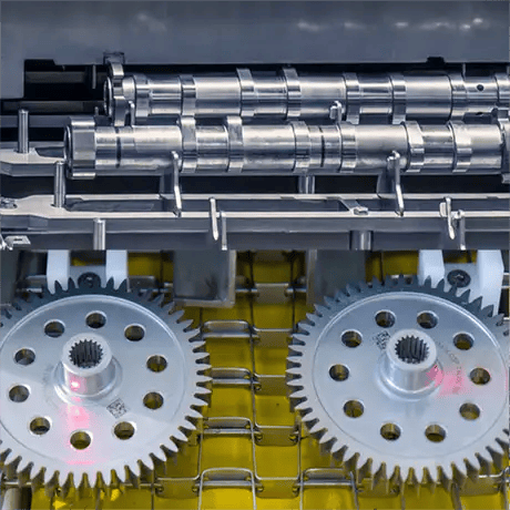 Environmentally friendly conveyor washer for a continuous spray cleaning process of parts like gear housings, camshafts, connecting rods and more
